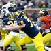 Quarterback Devin Gardner looks to get around defenders during the Michigan spring football game on Saturday, April 13. AnnArbor.com I Daniel Brenner